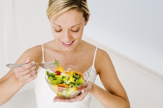 Young Woman Eating a Salad
